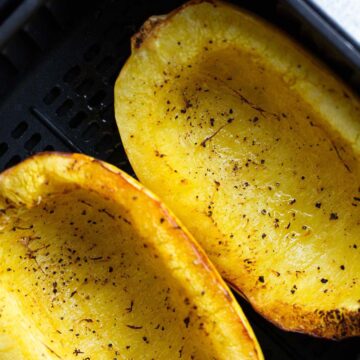 Spaghetti squash in air fryer basket.