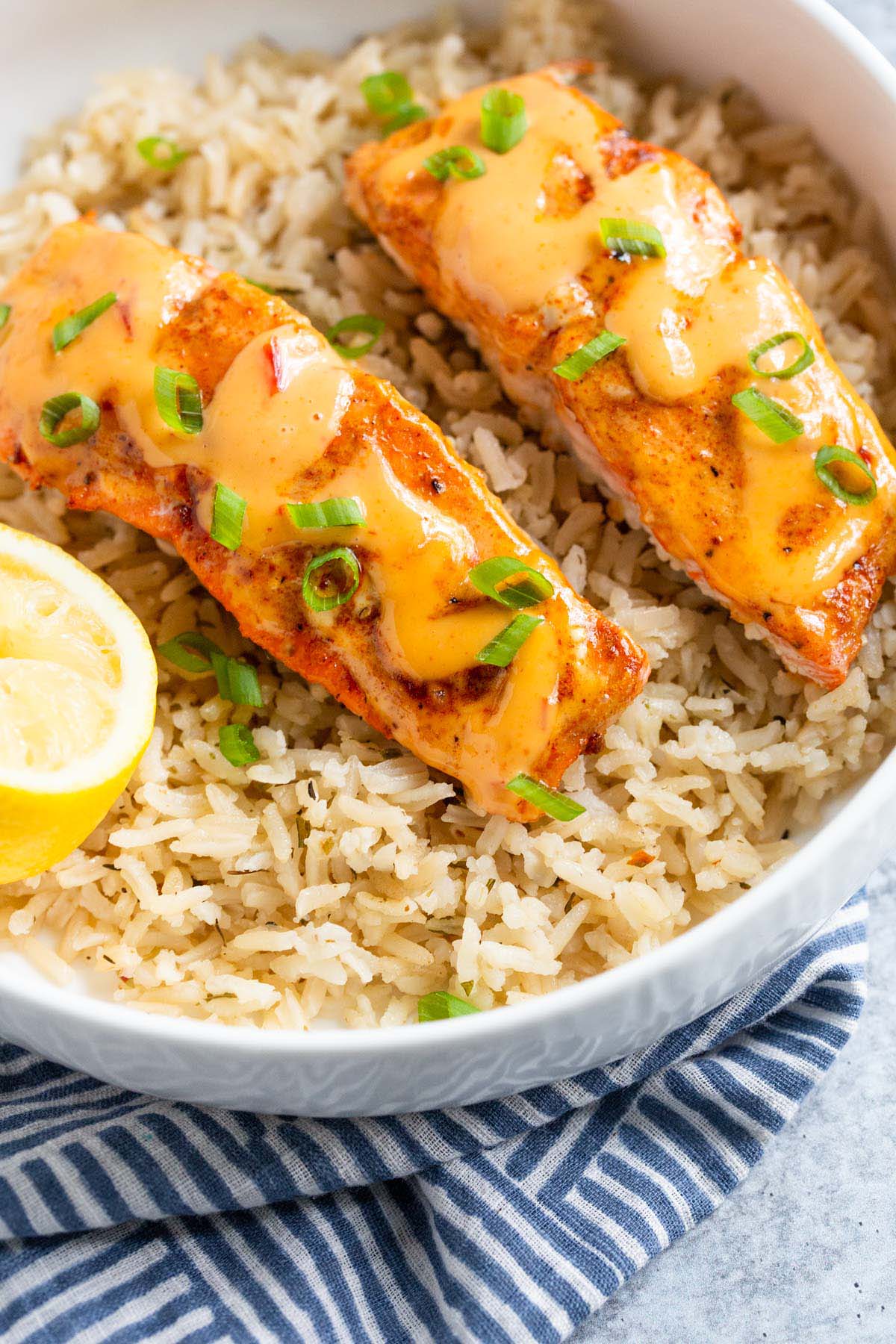 Salmon with bang bang sauce served over rice.