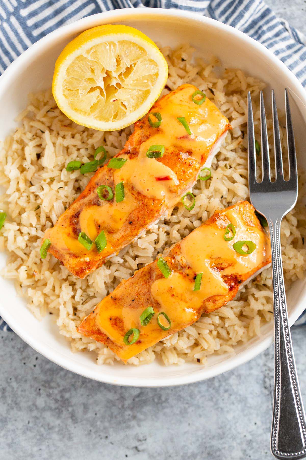 Salmon with bang bang sauce served over rice.