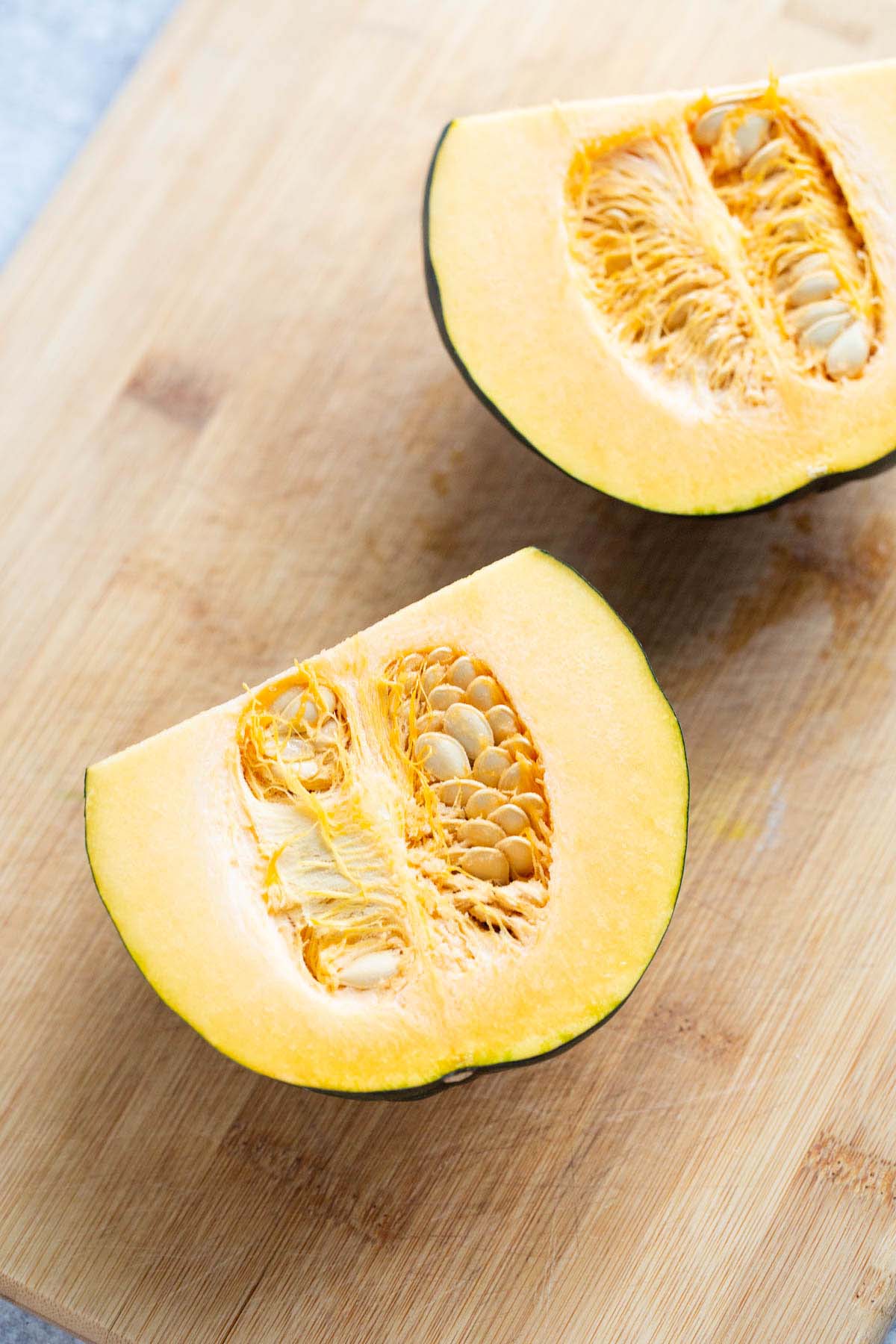 Acorn squash sliced in half.