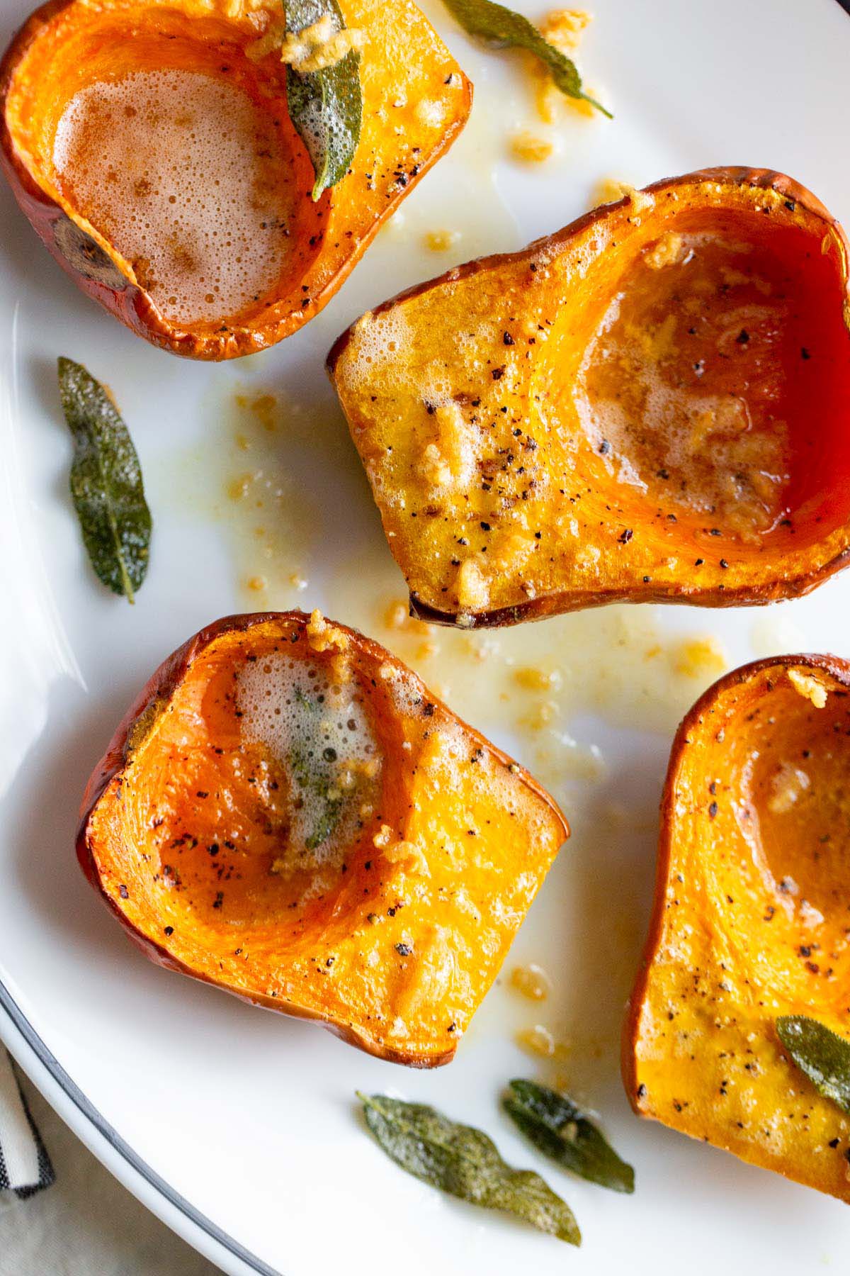 Honeynut squash topped with sage garlic butter from the top down.