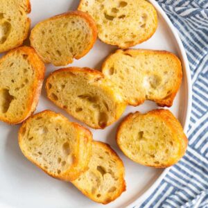 Air fryer crostini on a white plate.