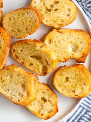 Air fryer crostini on a white plate.