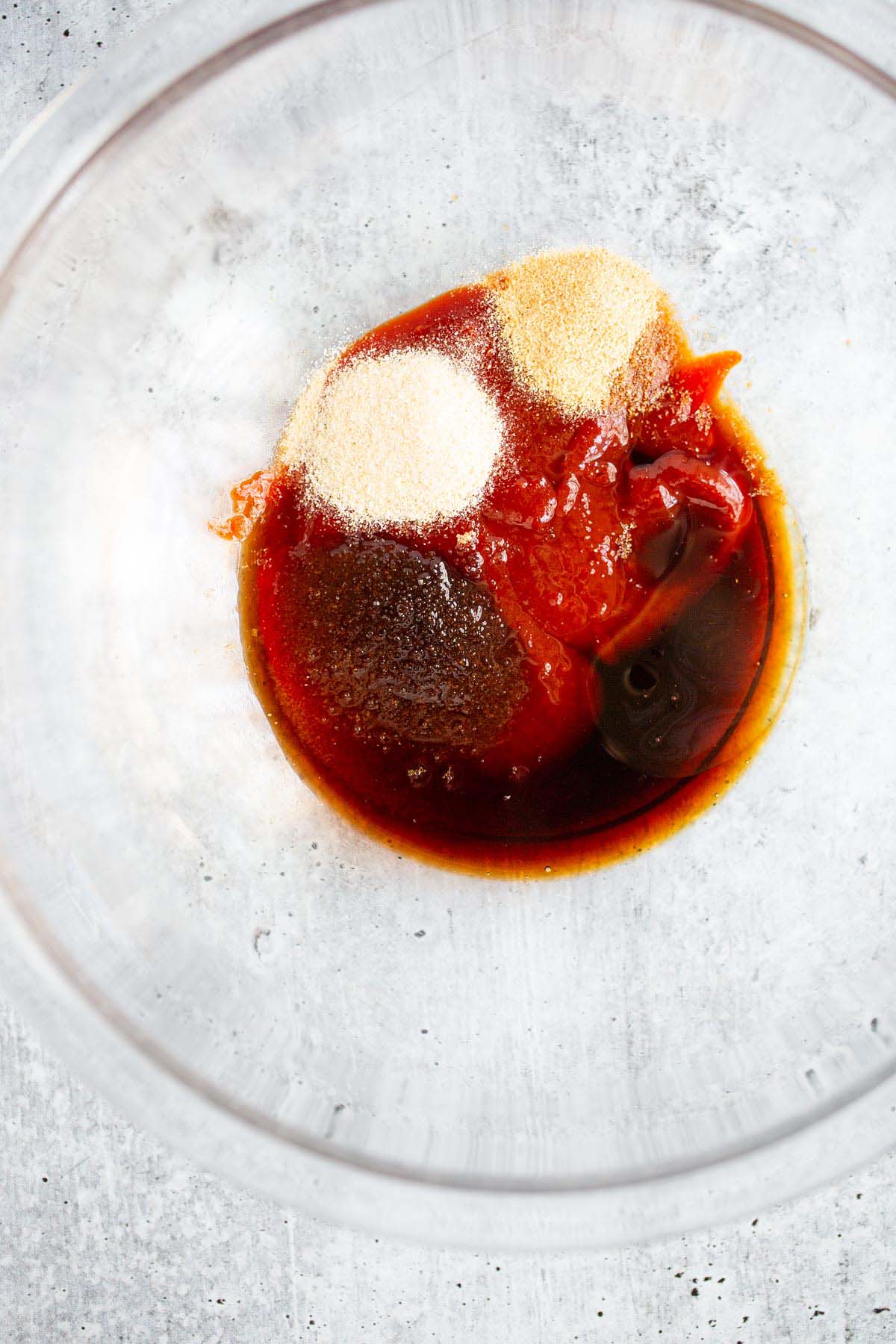 Sauce ingredients in a glass bowl.