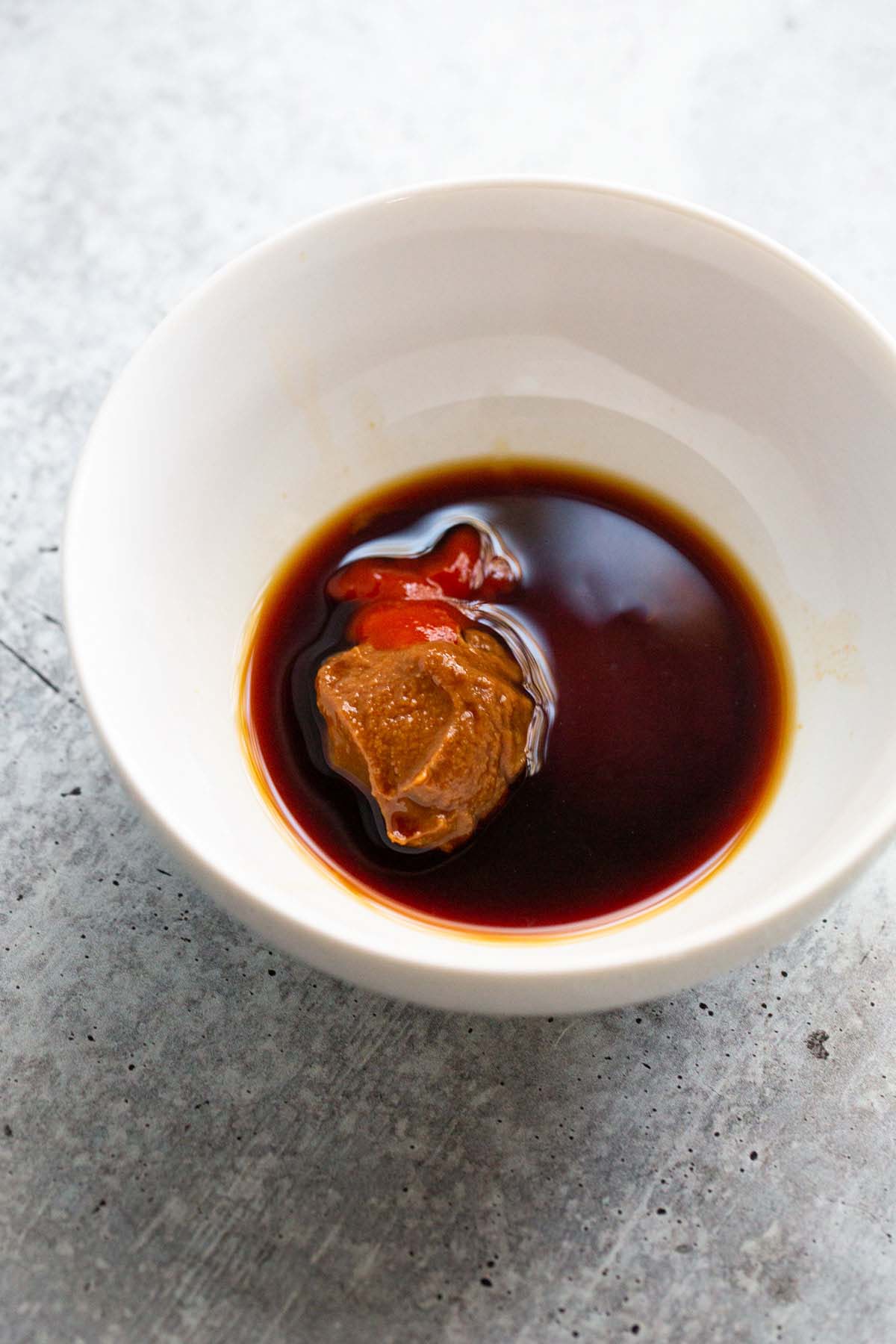 Miso glaze ingredients in a small white bowl.