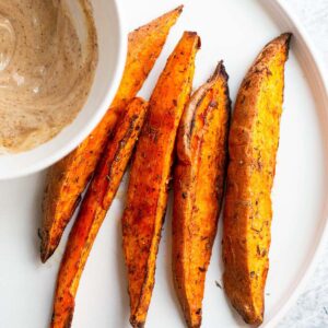 sweet potato wedges on a white plate.