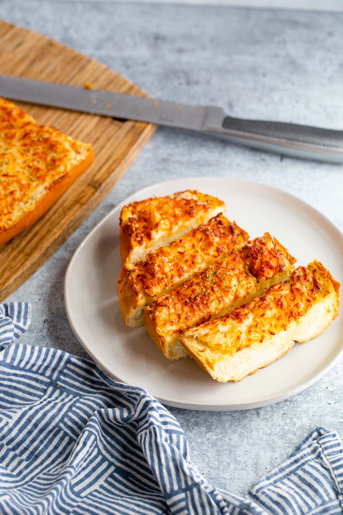 Sliced garlic bread on a plate.