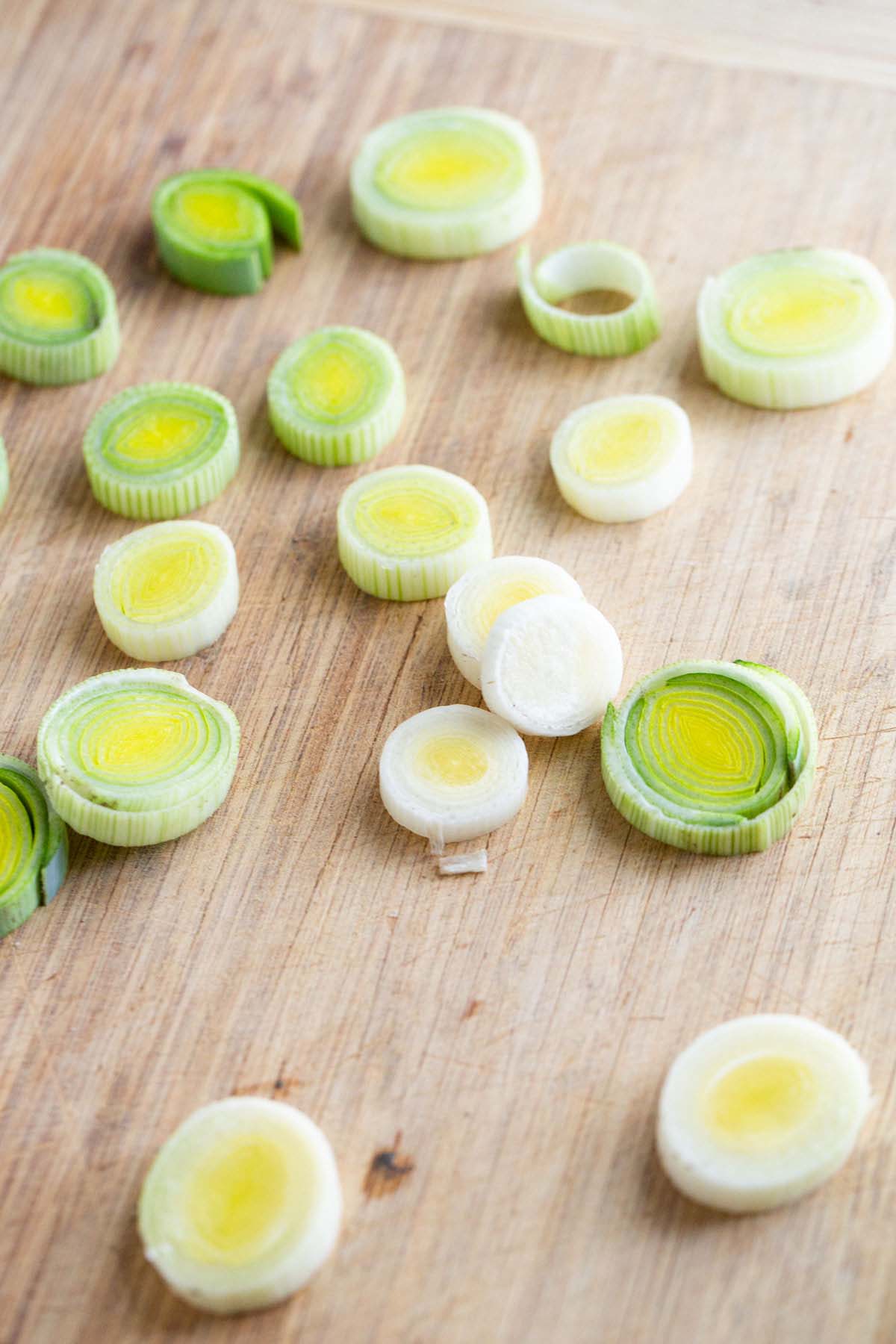 Sliced leeks on a cutting board.