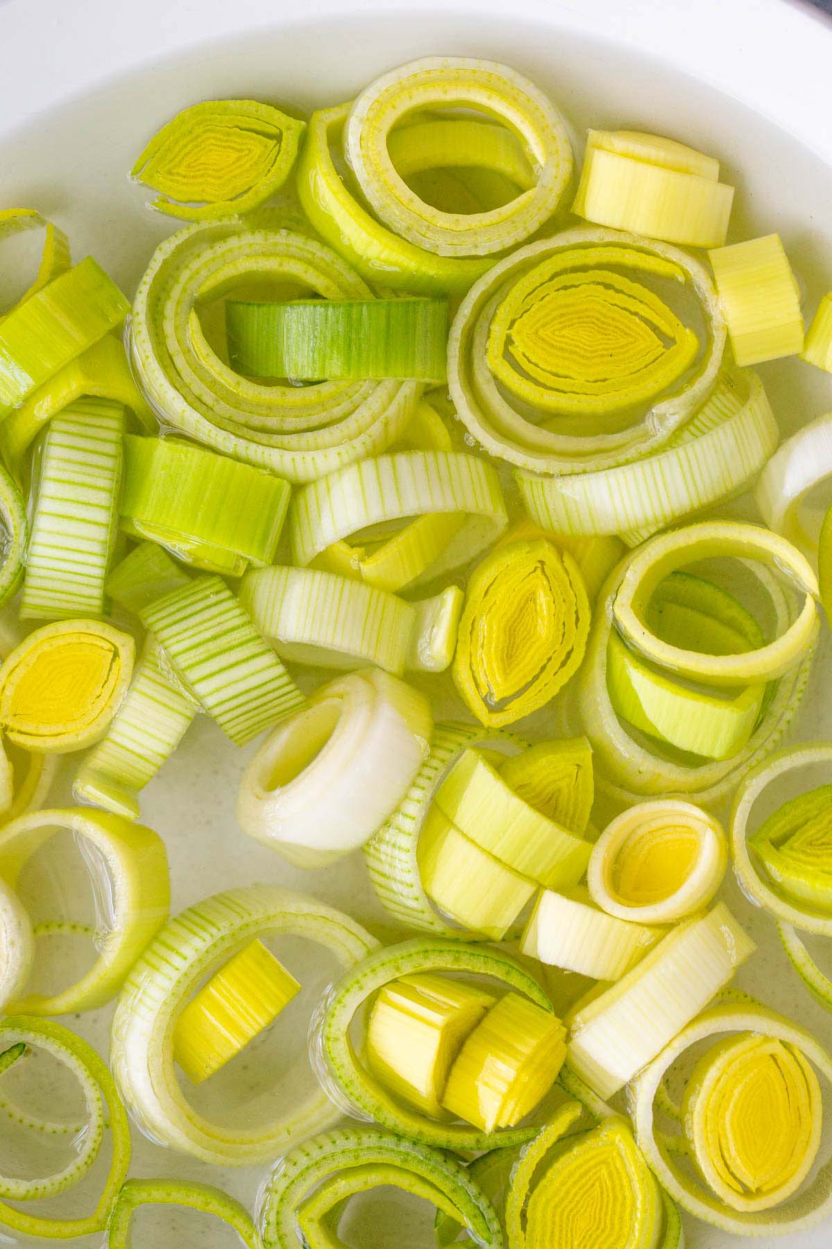 Leeks soaking in a bowl of water.