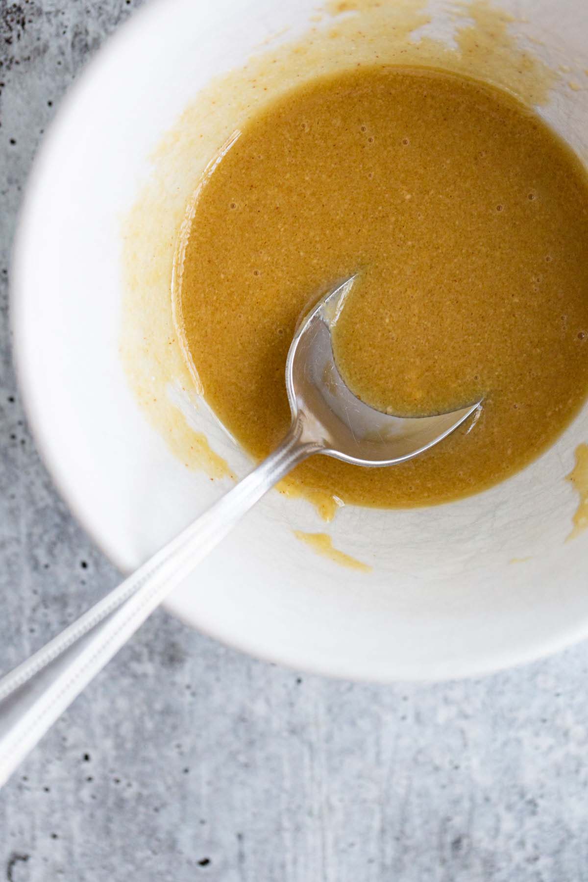 Maple dijon sauce in a bowl.