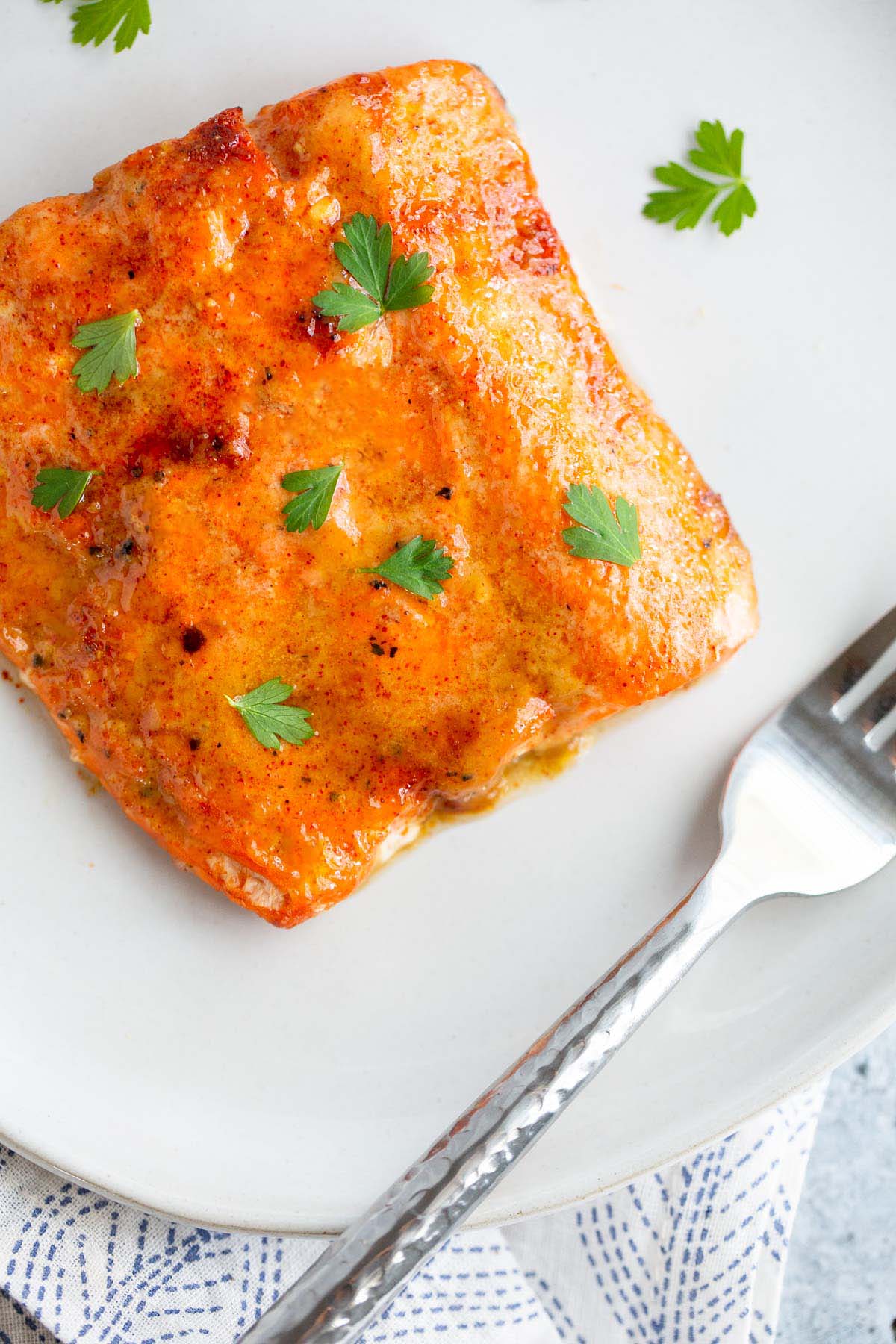 Air fryer maple dijon salmon on a white plate.