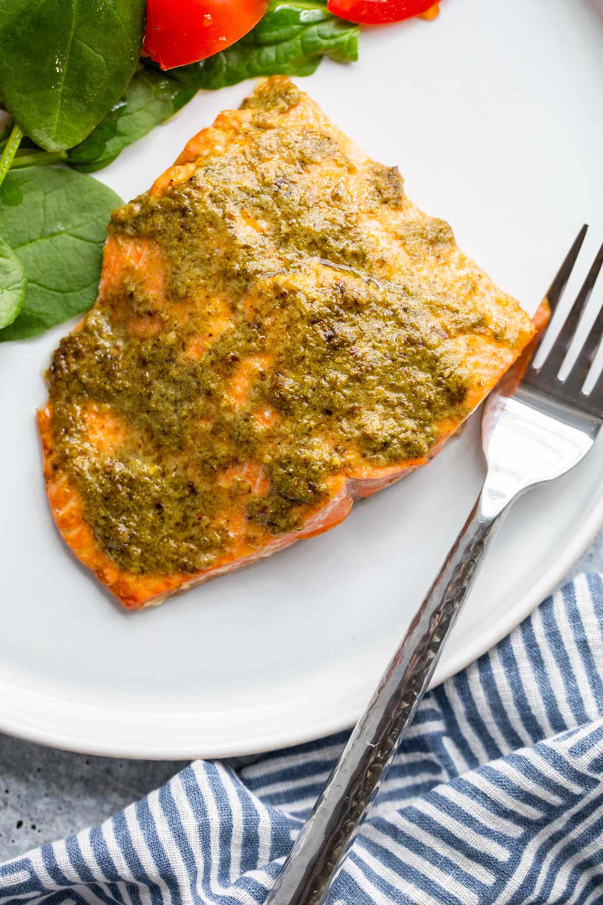 Air fryer pesto salmon on a white plate.