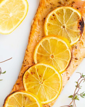 Air Fryer rainbow trout with lemon slices.