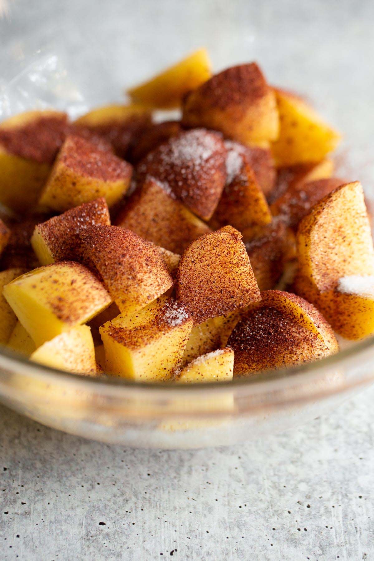 Sumac potatoes in a glass bowl.