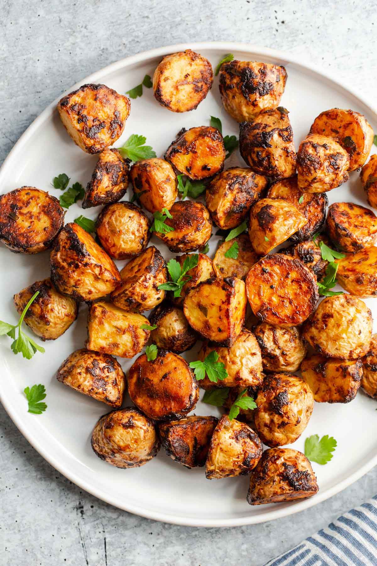 Air fried honey dijon potatoes on a plate.