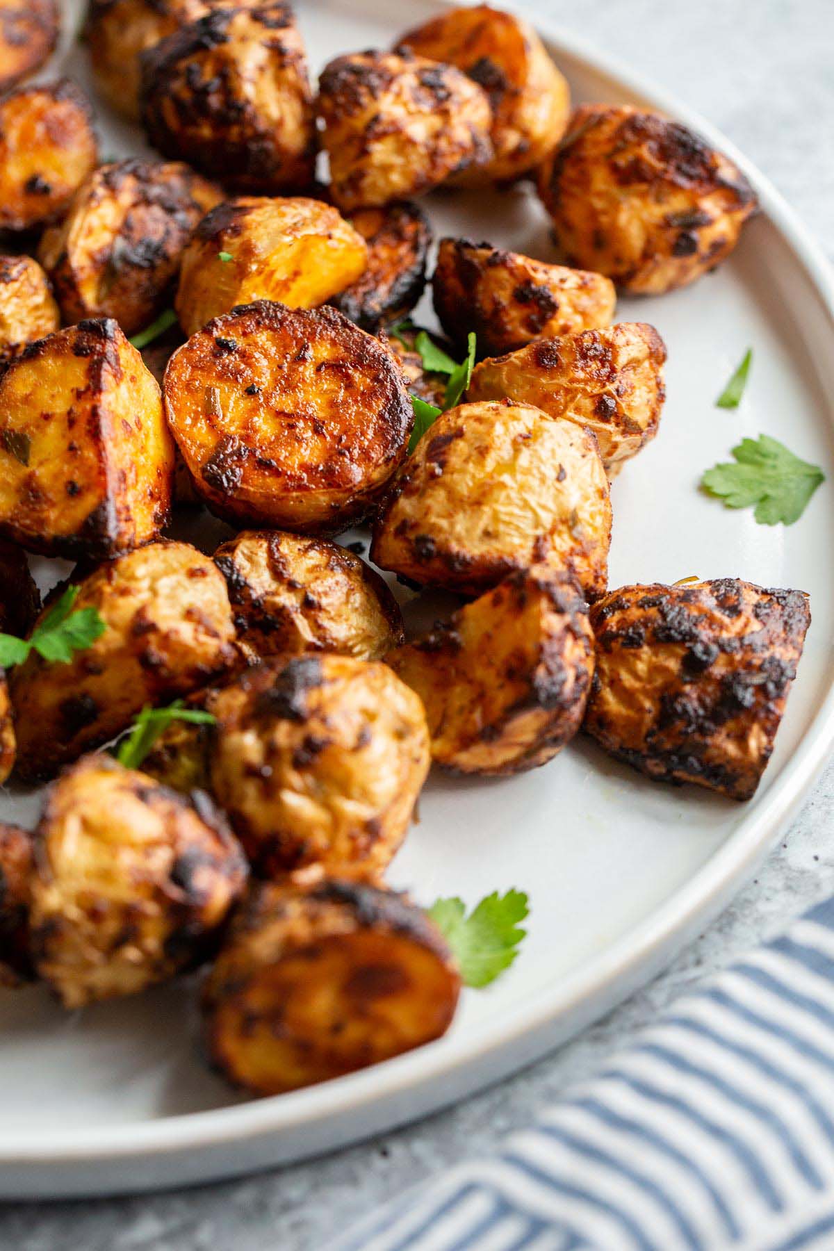 Air fried honey dijon potatoes on a plate.