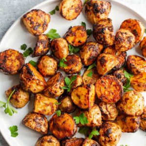 Air fried honey dijon potatoes on a plate.