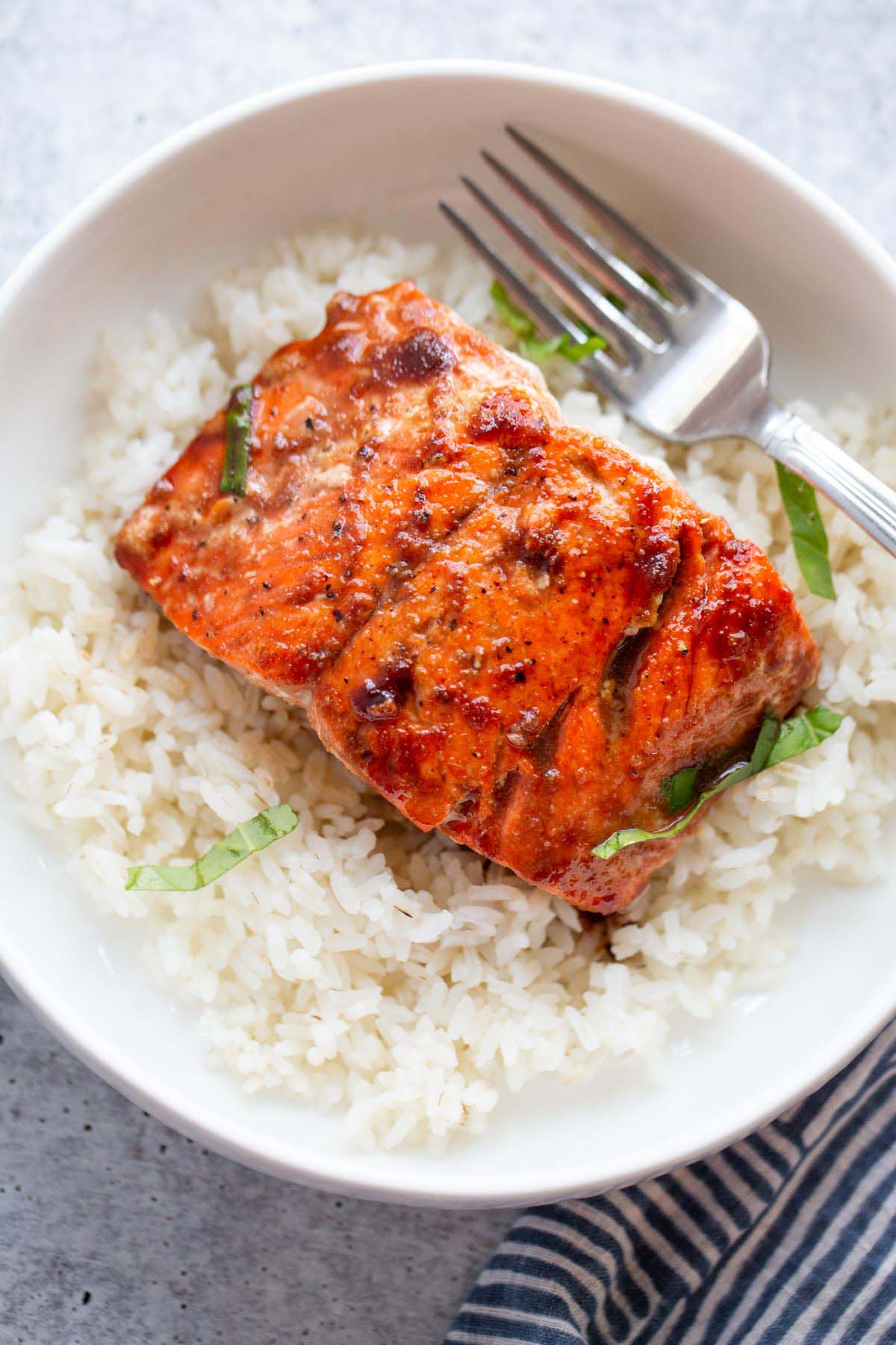 Salmon with rice and chopped basil.