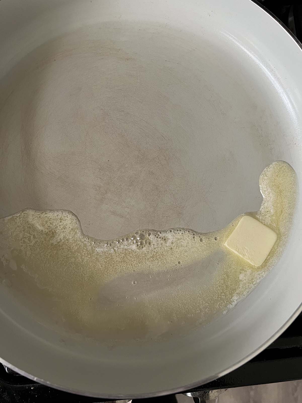 Butter melting in a skillet.