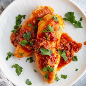 Calabrian chicken on a plate with parsley.