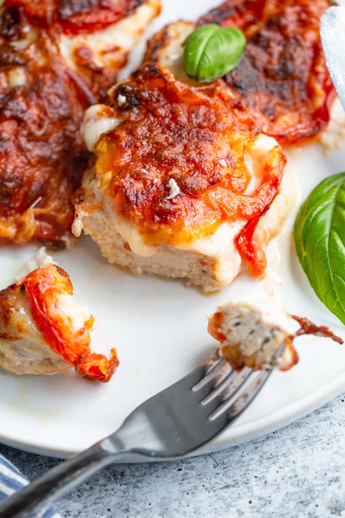 Air fryer caprese chicken on a plate up close.