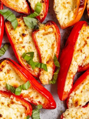 Feta stuffed mini peppers topped with basil.