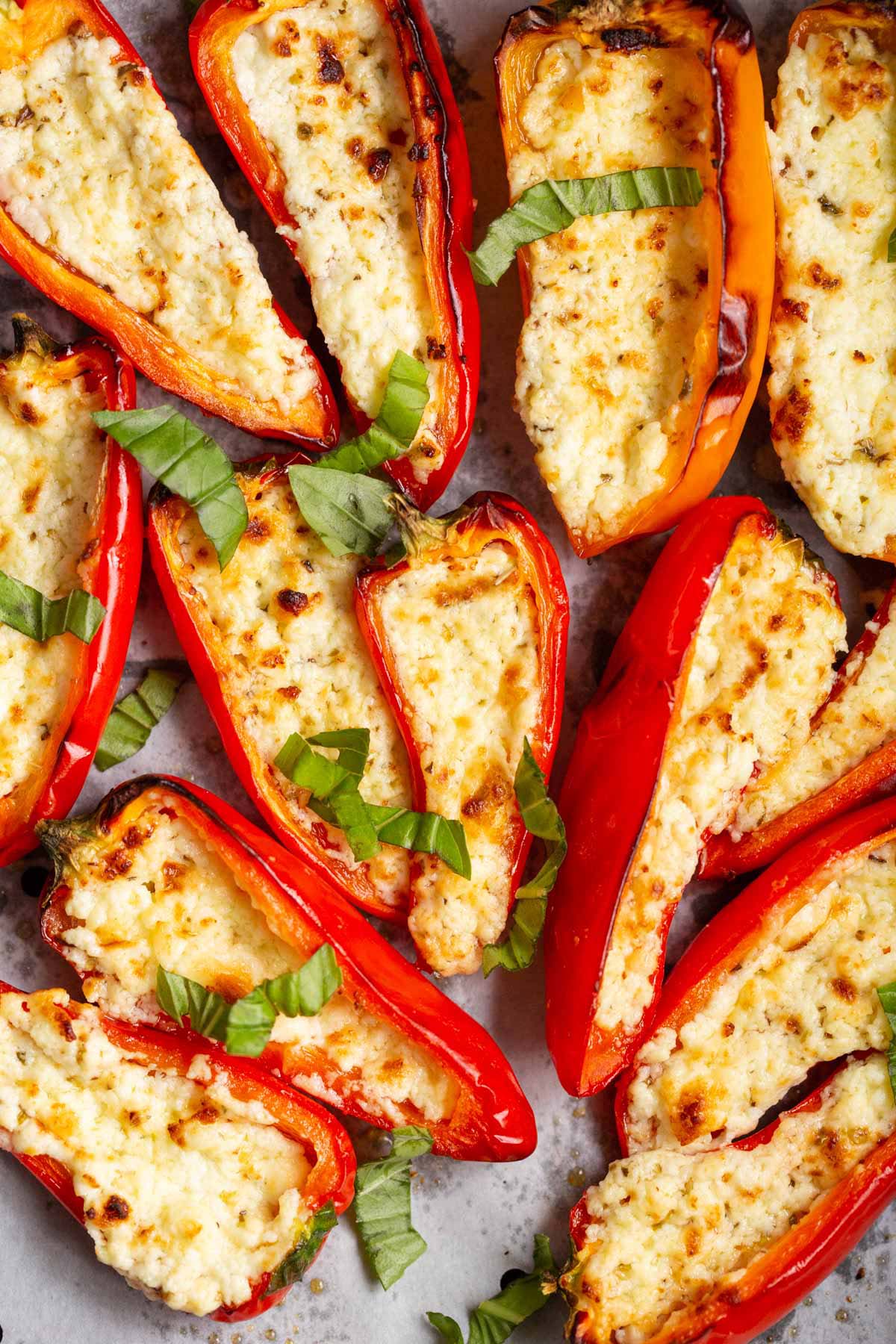 Feta stuffed mini peppers topped with basil.