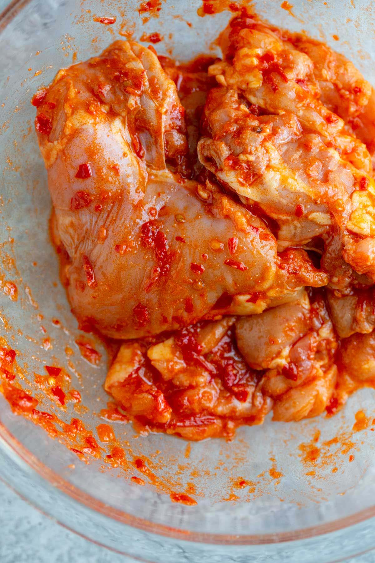 Chicken in a bowl with harissa.