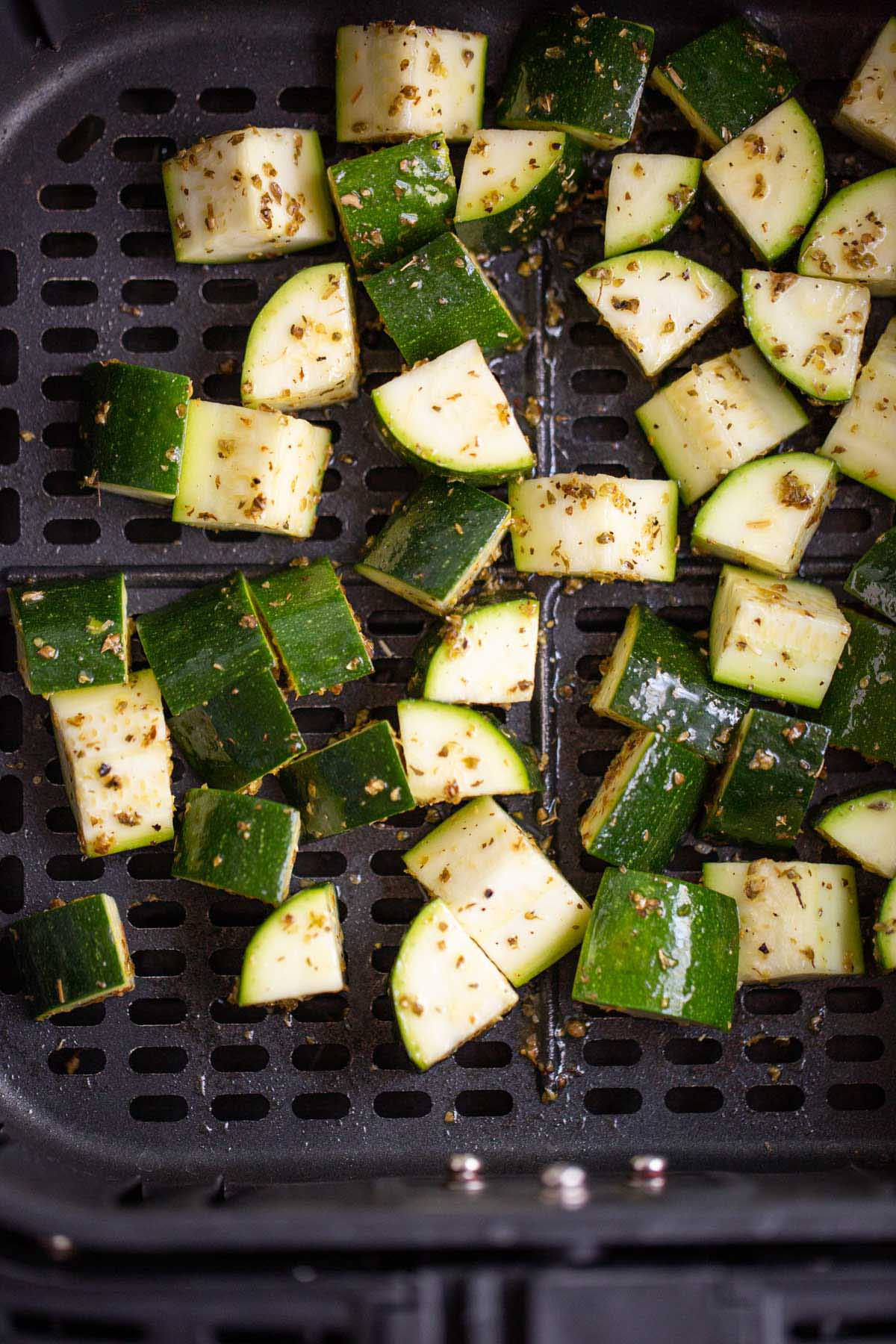 Uncooked zucchini in air fryer.