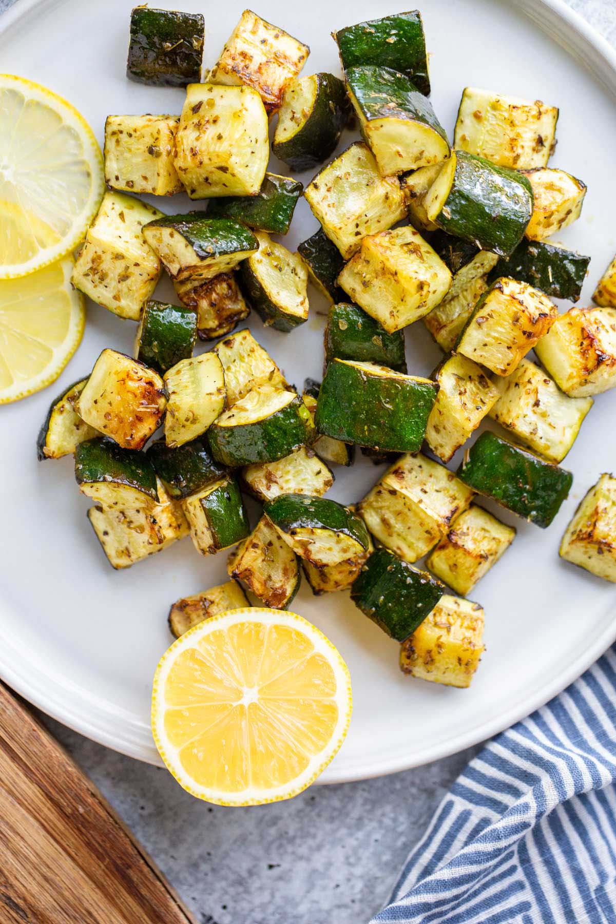 Roasted zucchini with lemon slices.