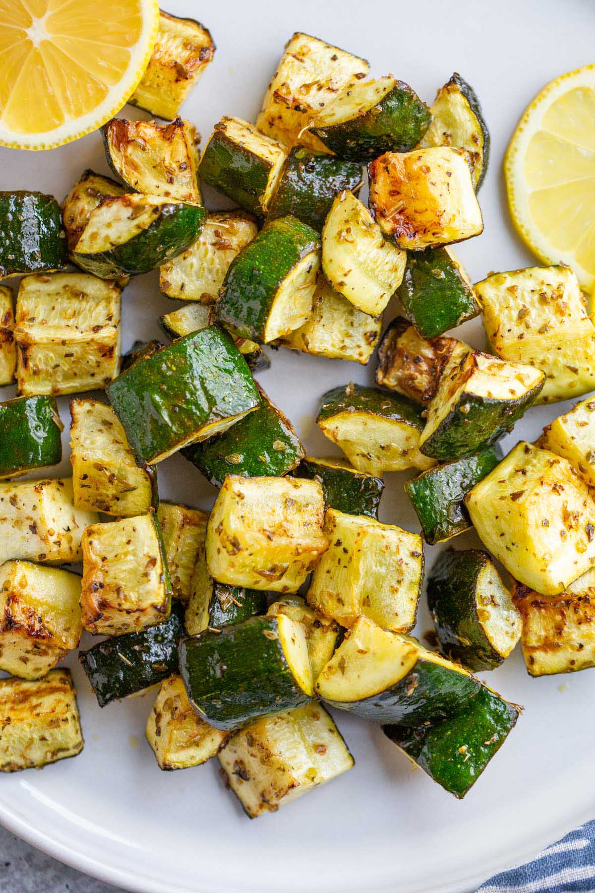 Roasted zucchini with lemon slices.