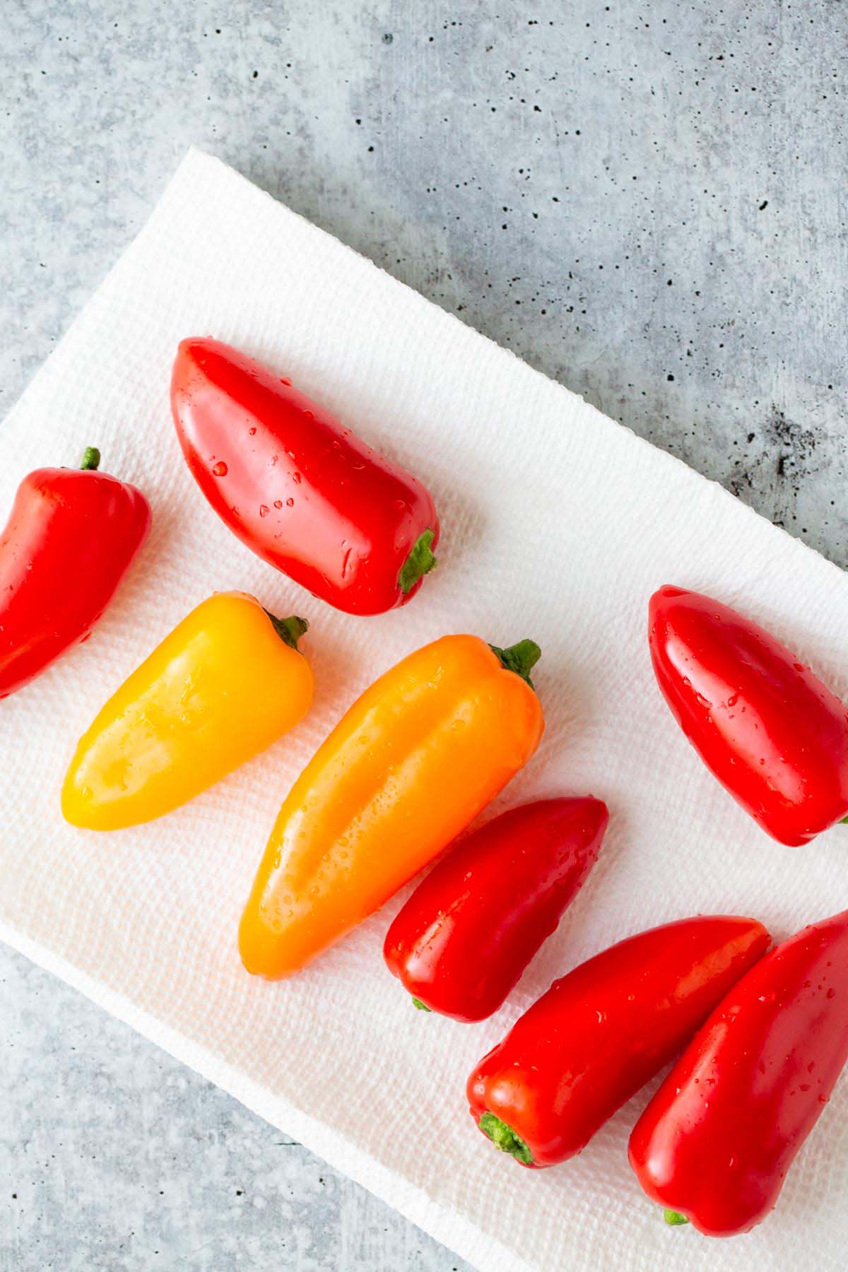 Red, orange, and yellow mini peppers.