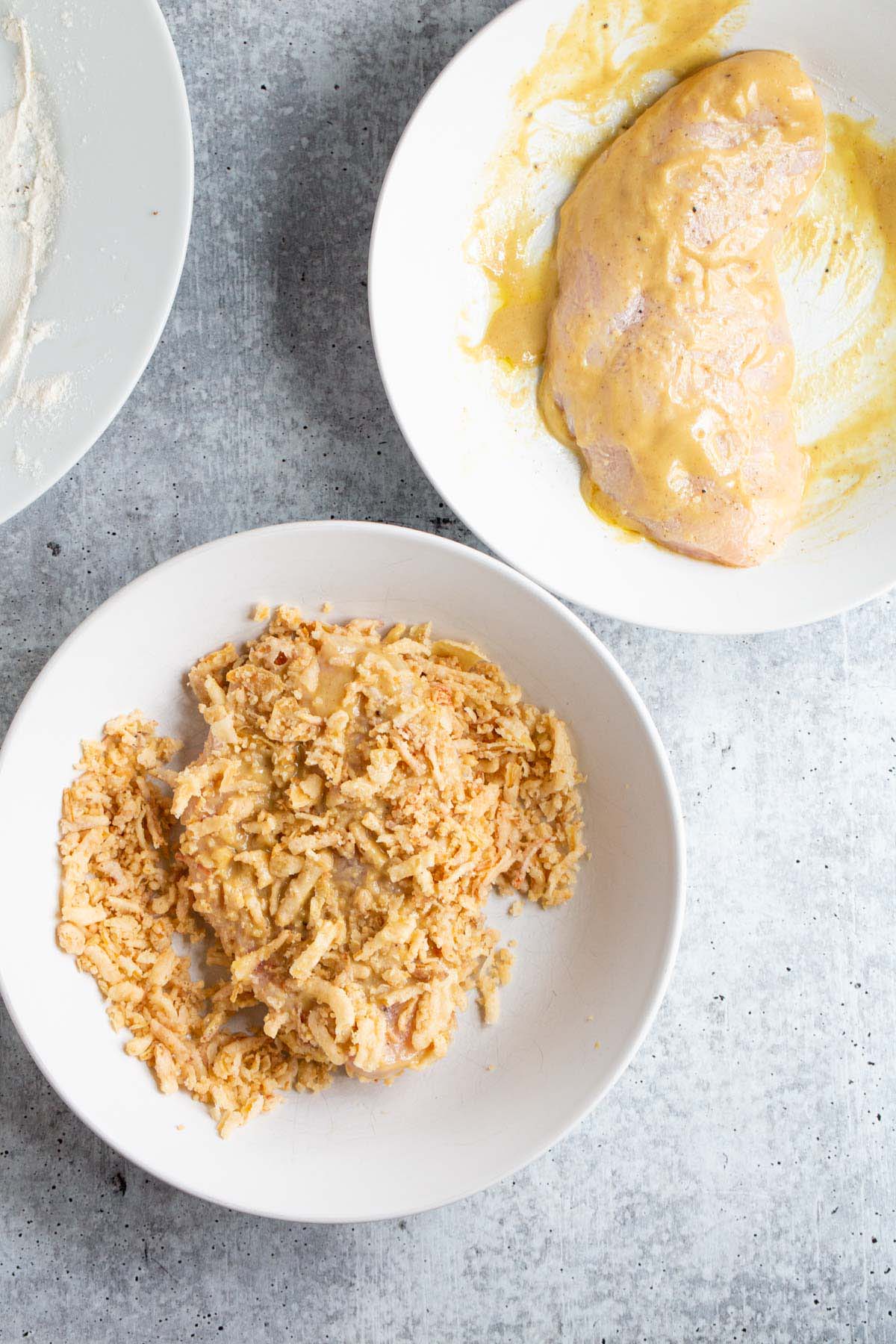 Breading chicken with crunchy onions.