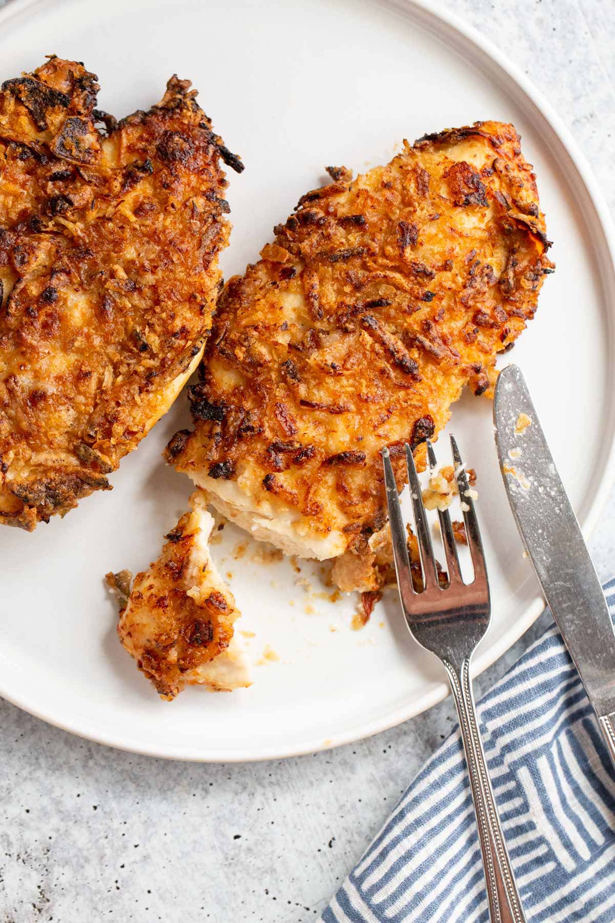 French onion crunch chicken on a white plate.