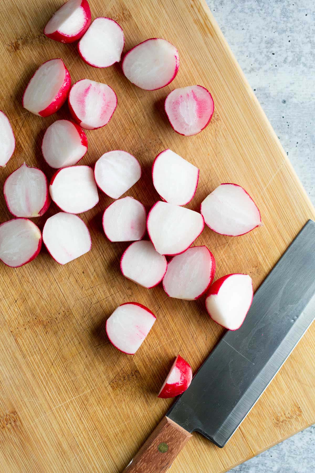 Radishes on a cutting board.