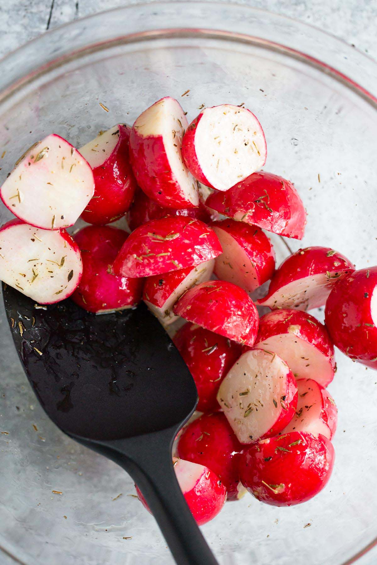 Radishes tossed with oil and herbs.