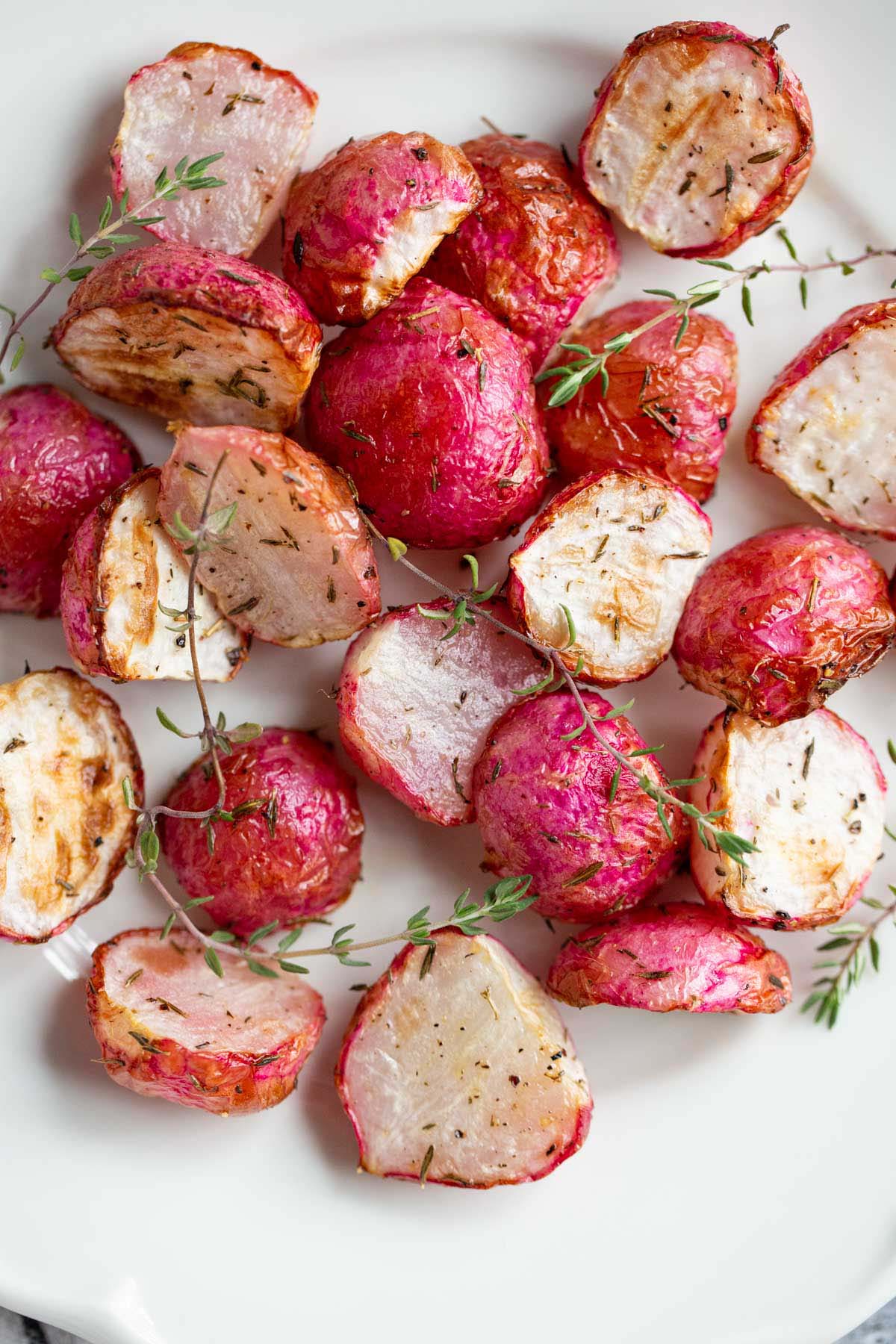 Air fried radishes on a white plate.