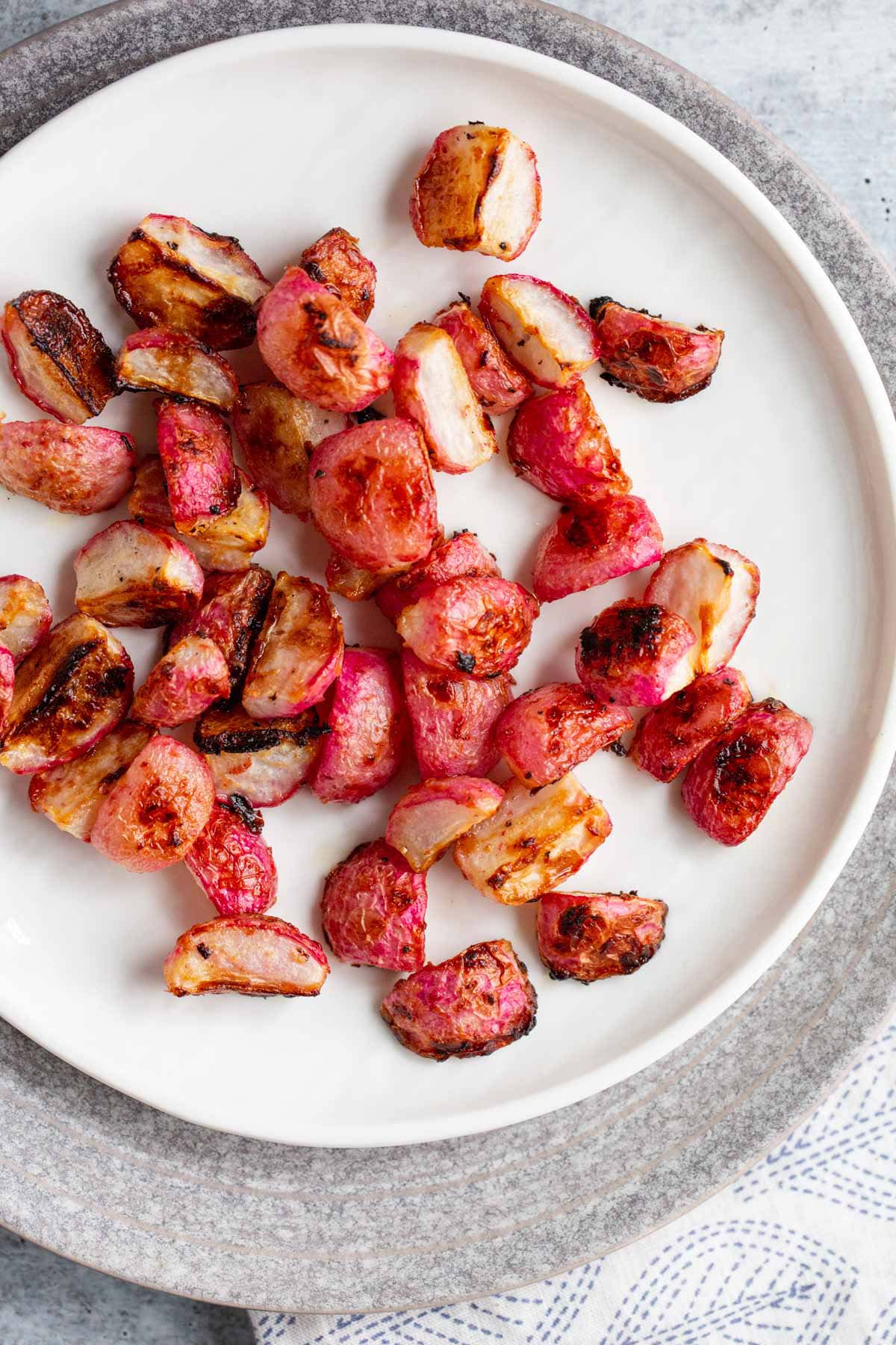 Roasted miso radishes on a plate.