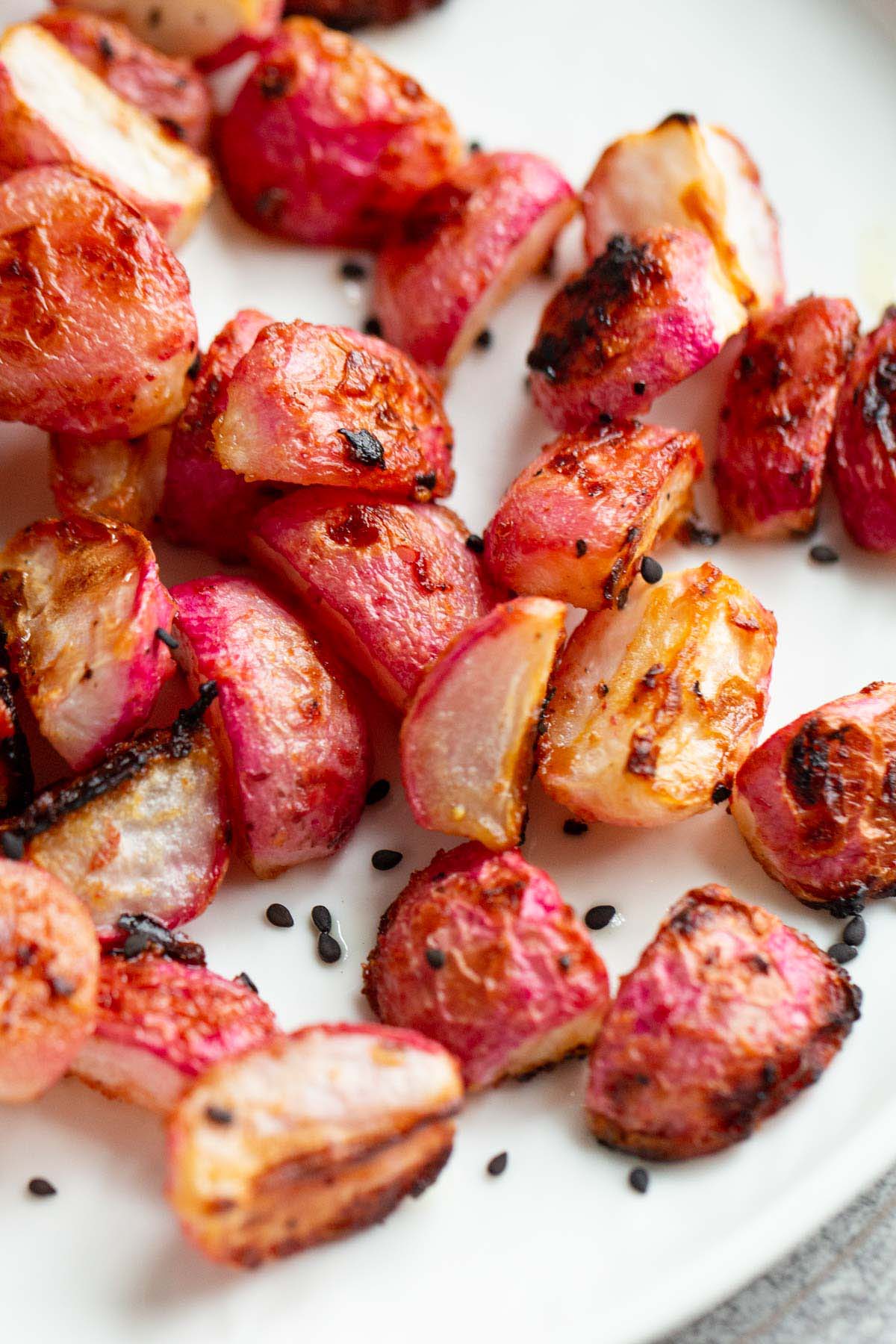 Roasted miso radishes topped with black sesame seeds