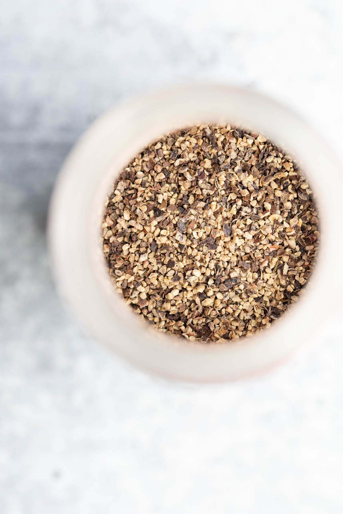 Black pepper in a container.