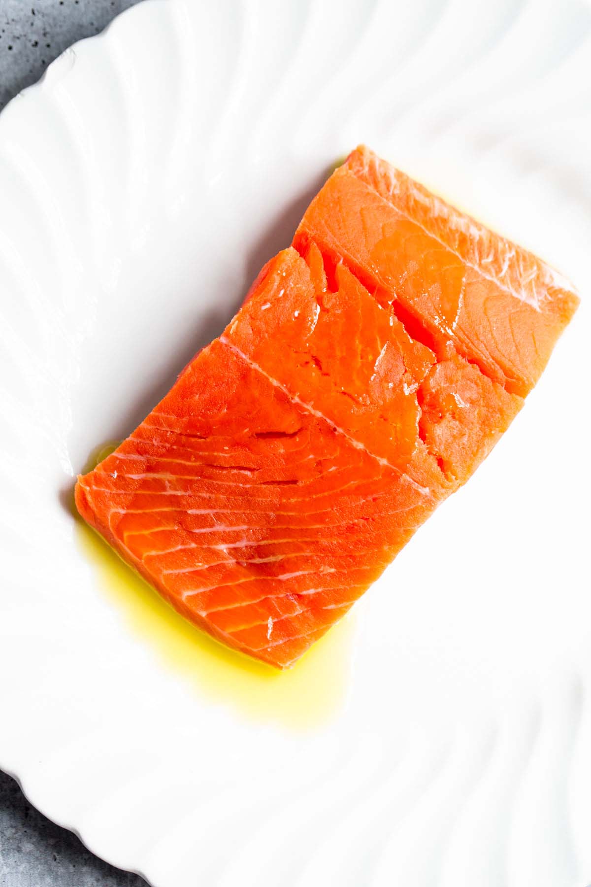 Raw salmon drizzled with olive oil.