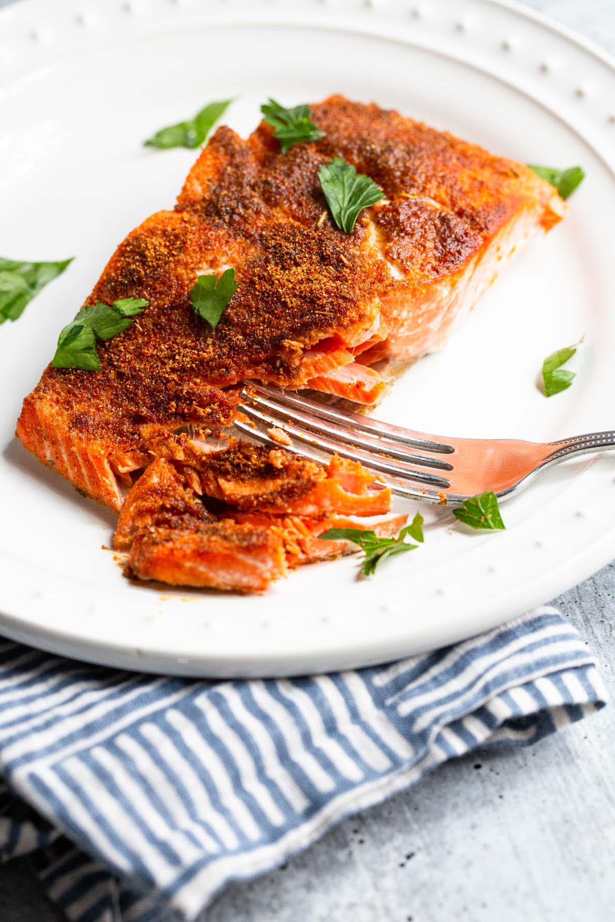 Air fryer blackened salmon on a plate.