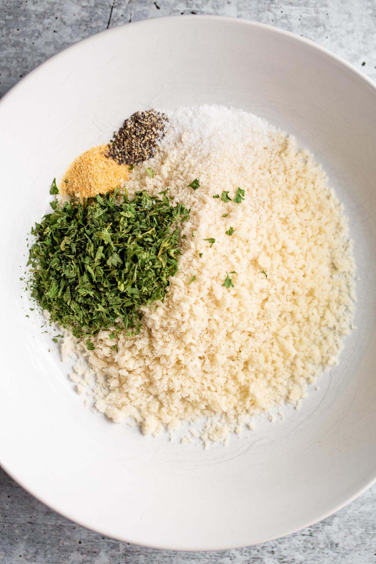 Panko and seasonings in a shallow bowl.