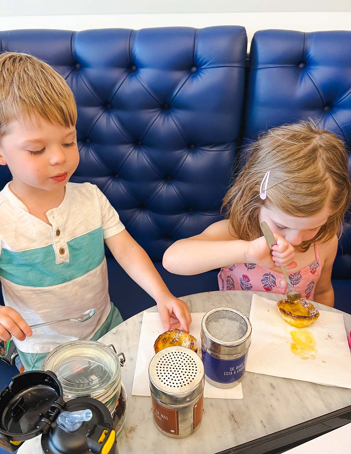 Kids eating Pastel de Nata.