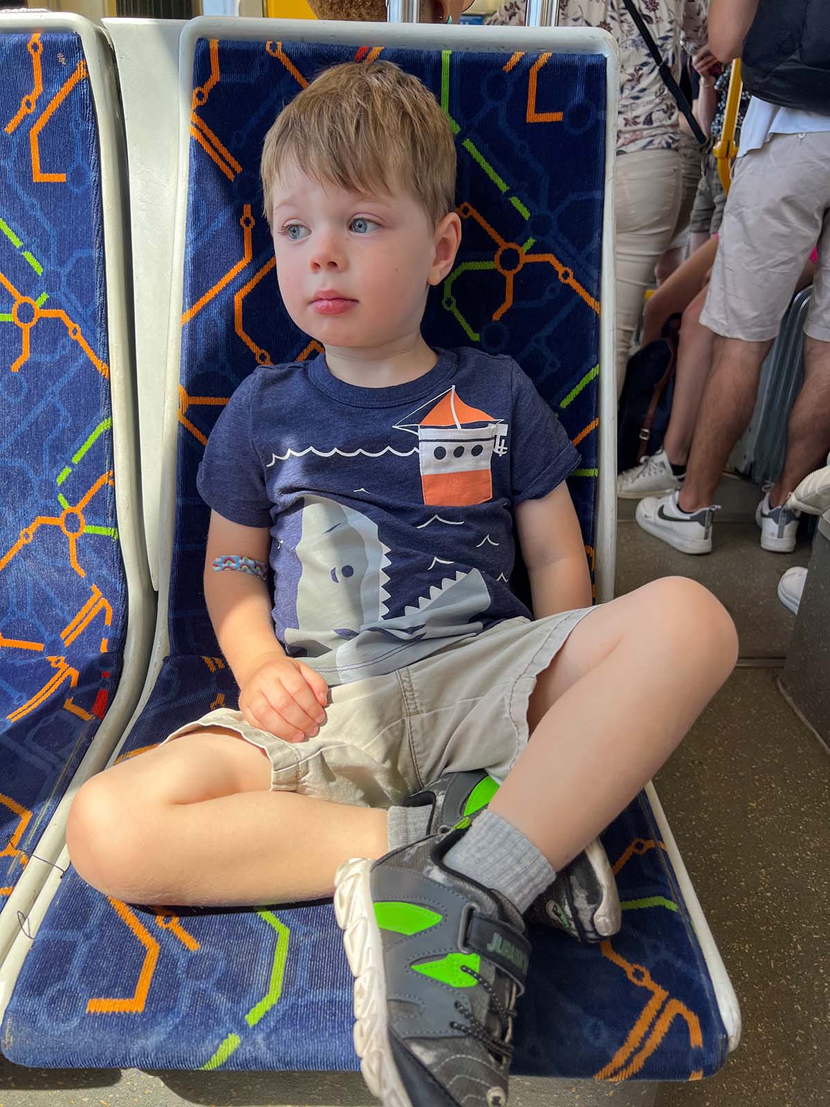 Boy riding a bus in Lisbon.