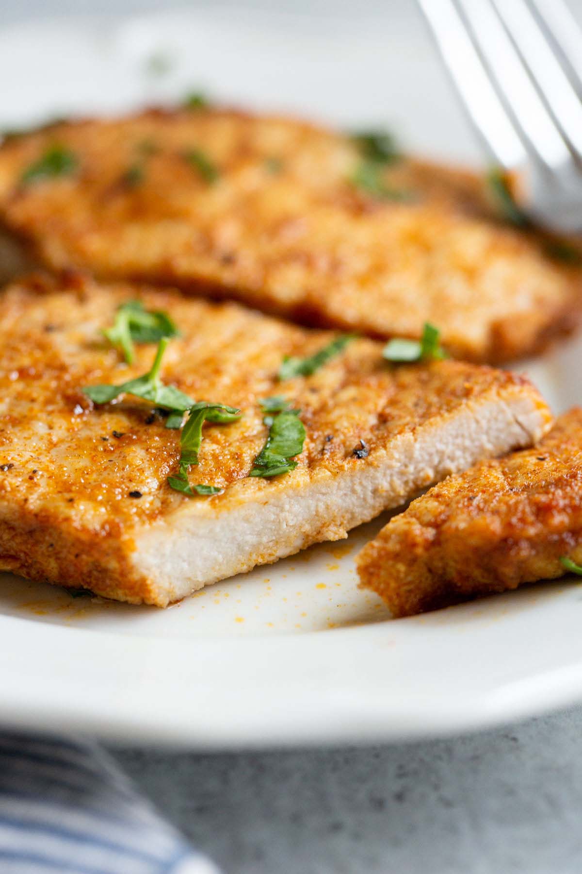 Sliced pork chop on a plate.