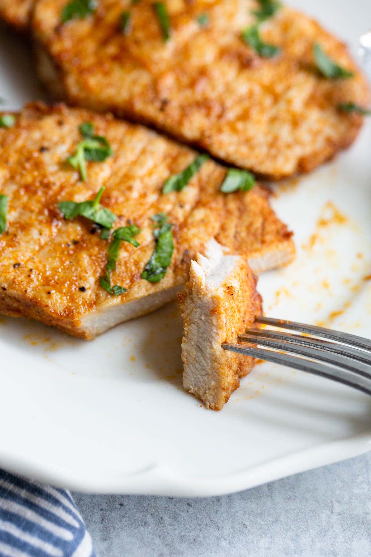 Sliced pork chop on a plate.