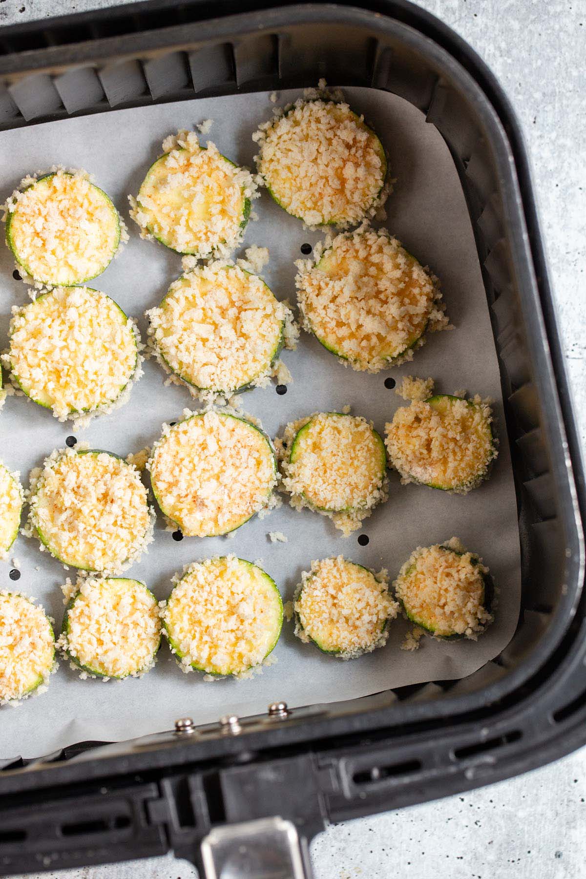 uncooked breaded zucchini in air fryer