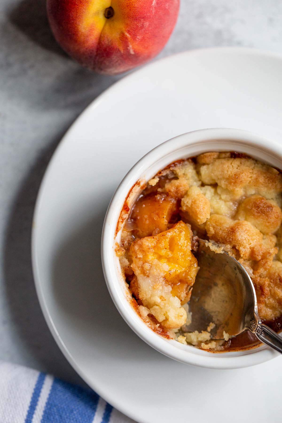 Peach cobbler in a ramekin.