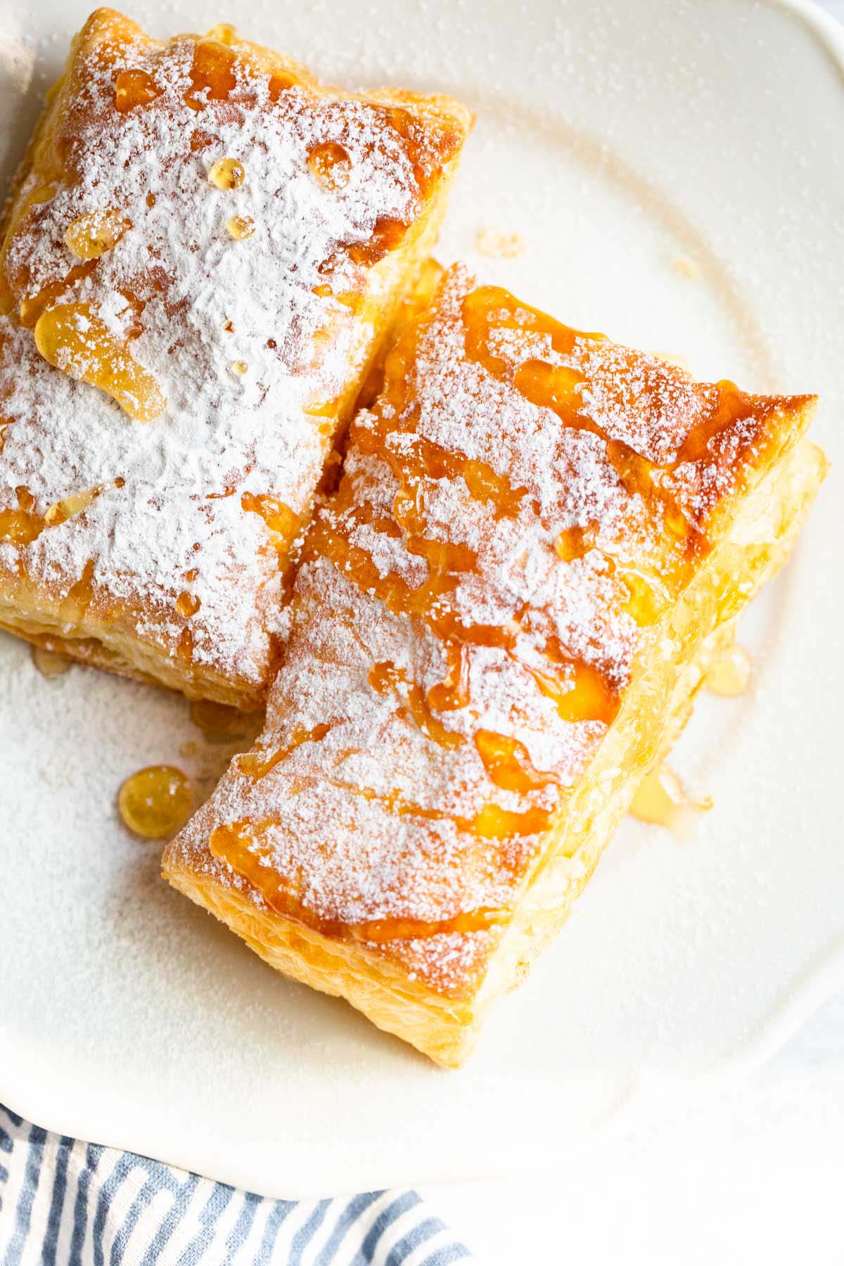 Air fried puff pastry with powdered sugar and honey.